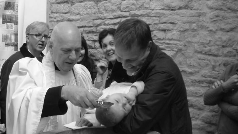 Image of child being baptised at Beauchief Abbey